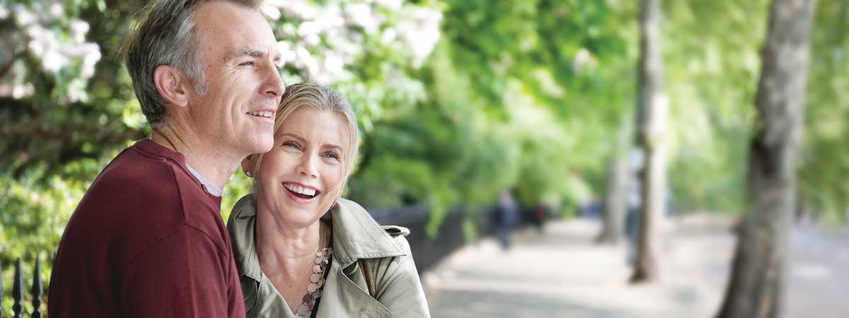 Couple sitting on bench outside