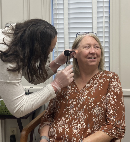 A female patient receiving an ear examination from one of our expert audiologists